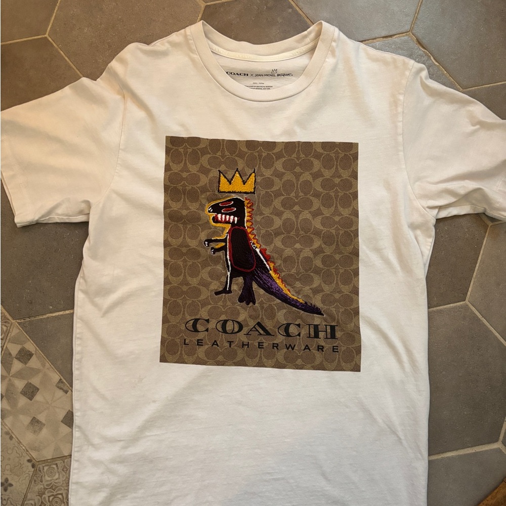 Coach Basqiat t shirt. Small mark on front as seen in the second image.